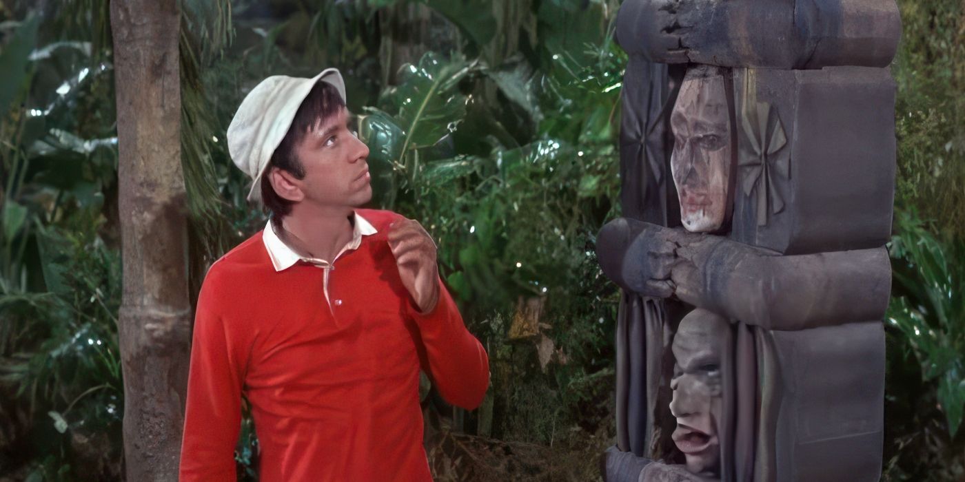 Bob Denver as Gilligan looks up at a totem pole in the jungle in Gilligan's Island.