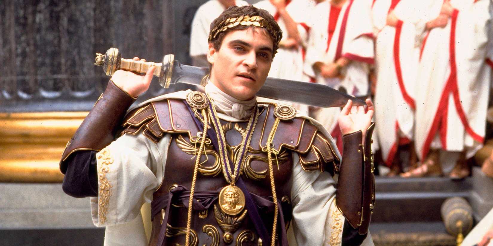 Joaquin Phoenix as Commodus with a sword around his shoulders in 'Gladiator'