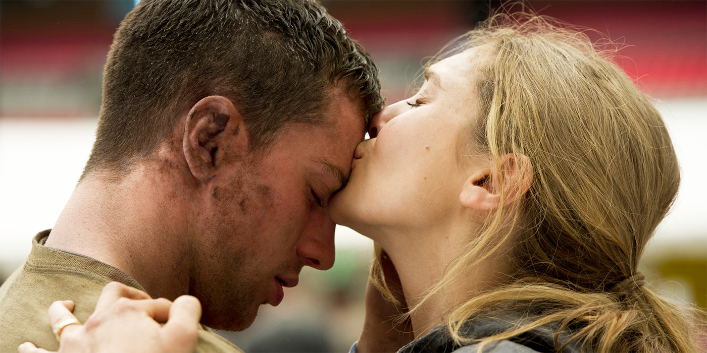 Elizabeth Olsen kissing Aaron Taylor-Johnson on the forehead in Godzilla (2014)