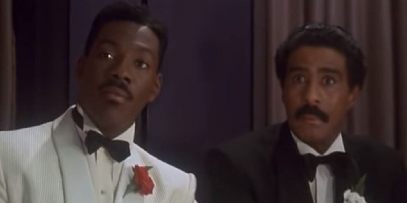  Eddie Murphy and Richard Pryor studying a rival gangster in Harlem Nights