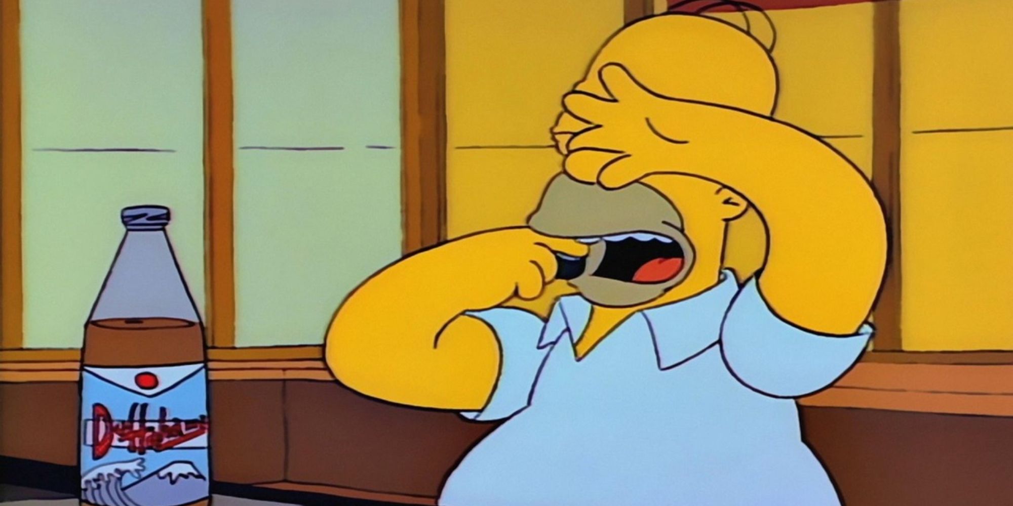 Homer covering his eyes and poiting at his open mouth in The Simpsons
