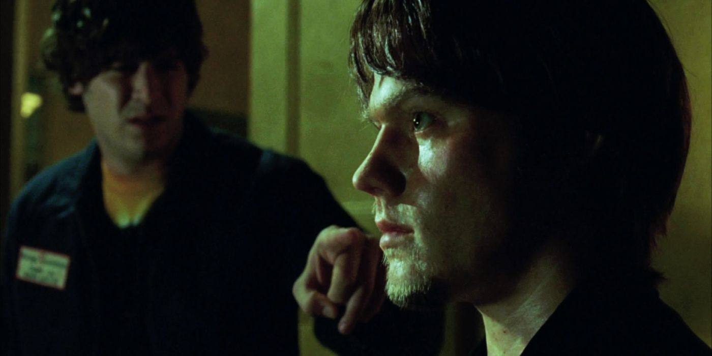 Close up of Dalton (Jared Padalecki) on the phone near Wade (Jon Abrahams) in House of Wax