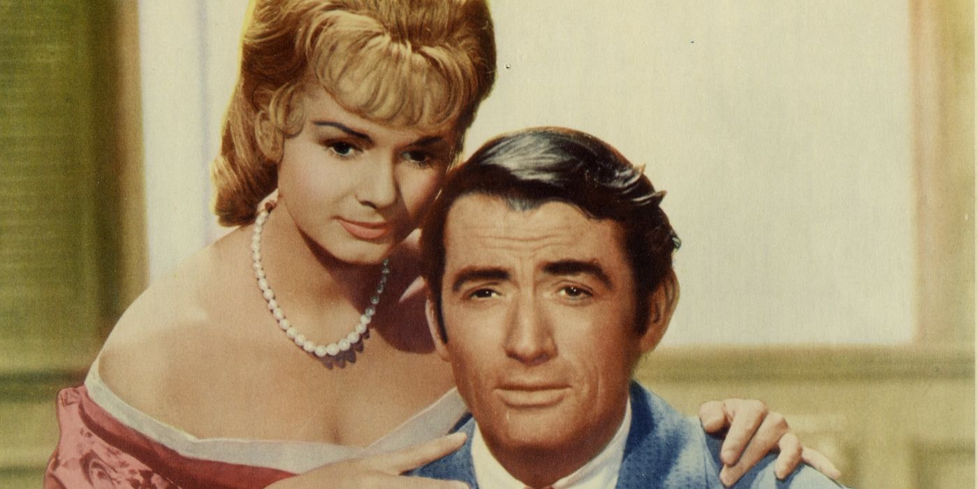 Debbie Reynolds and Gregory Peck on a lobby card for How the Was Was Won