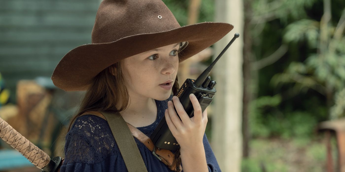 Cailey Fleming as Judith using walkie talkie in The Walking Dead