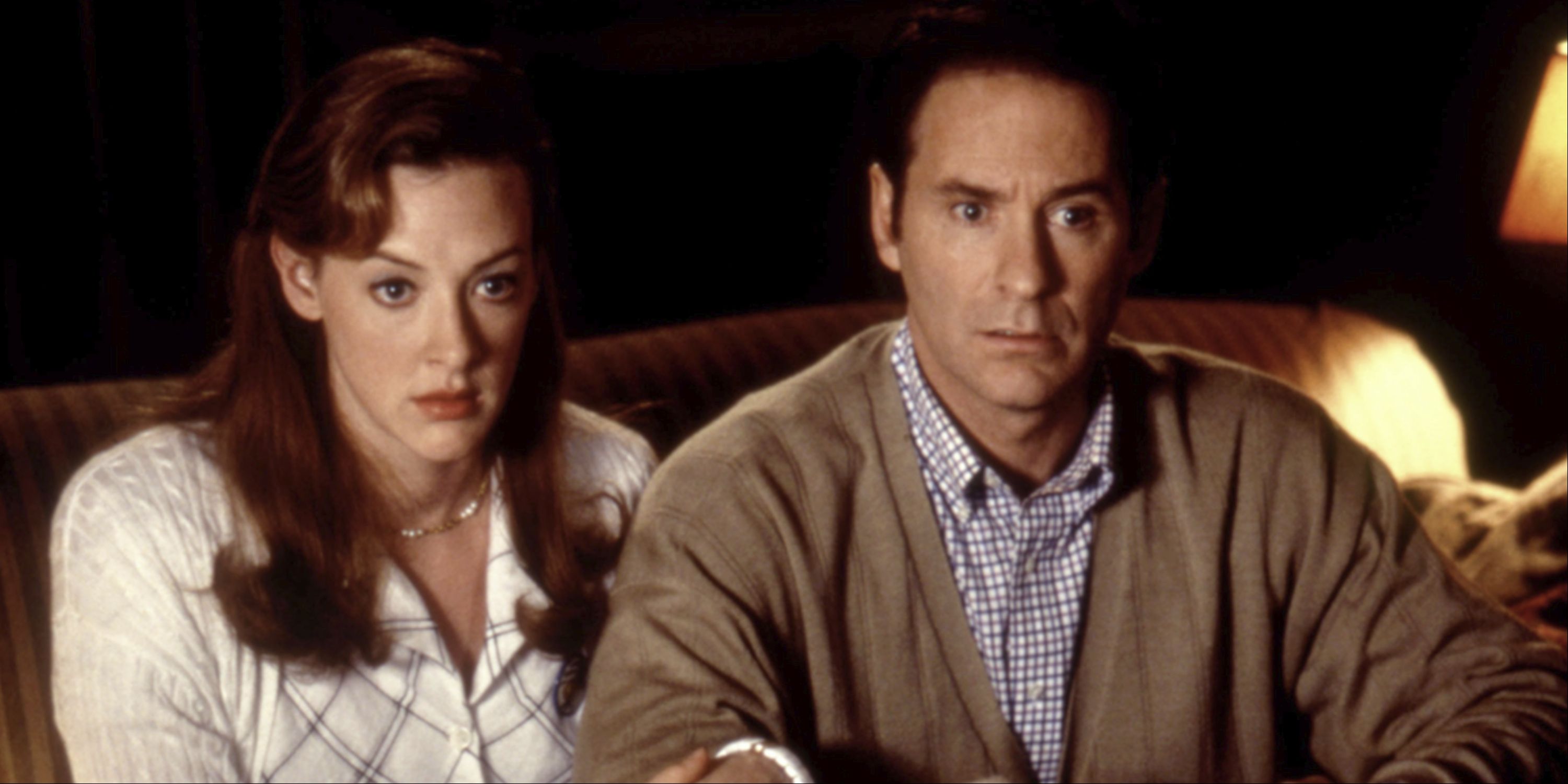Emily and Howard looking ahead with puzzled expressions in In and Out