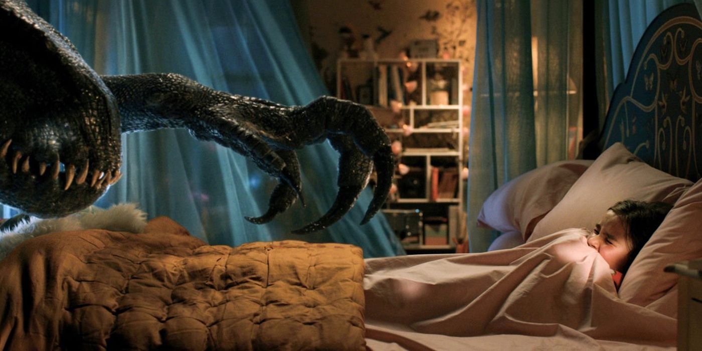Indoraptor reaches for a frightened Maisie in her bed in &lsquo;Jurassic World: Fallen Kingdom&rsquo;