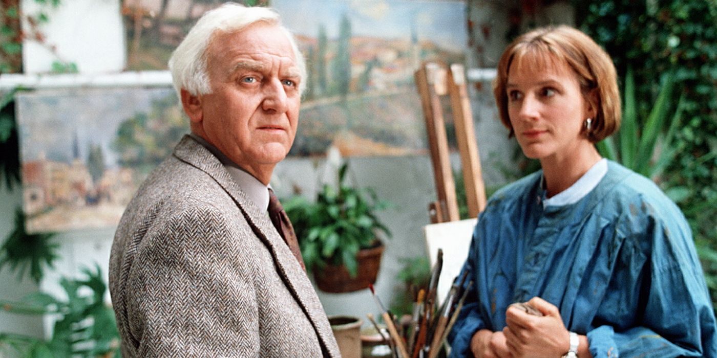 Inspector Morse speaks with a young woman in an art studio littered with green plants.