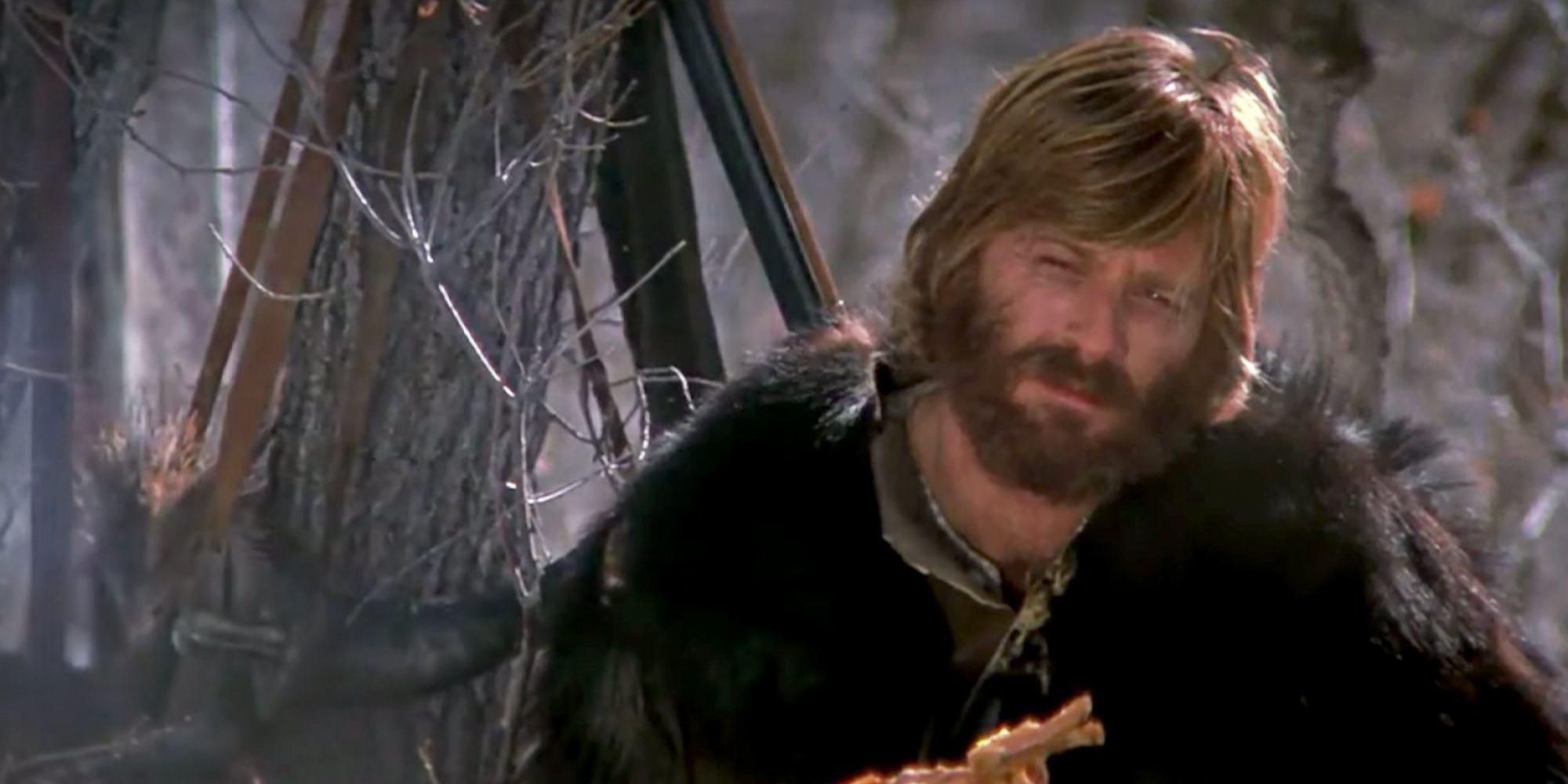 Robert Redford as Jeremiah Johnson rests for a moment in the woods in Jeremiah Johnson.