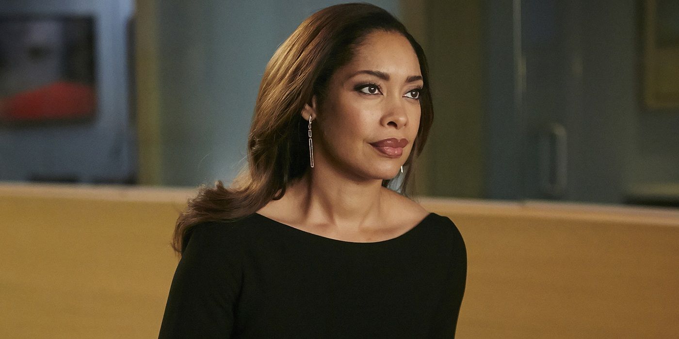 Gina Torres looking at a person offscreen in Suits