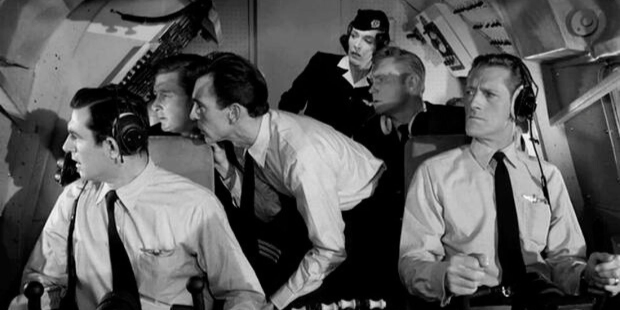 John Anderson, Beverly Brown, Paul Comi, Wayne Heffley, Sandy Kenyon and Harp McGuire all looking out the side of an airplane cockpit in The Twilight Zone