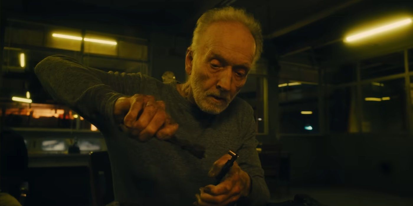 Tobin Bell as John Kramer/Jigsaw working on a trap in Saw X