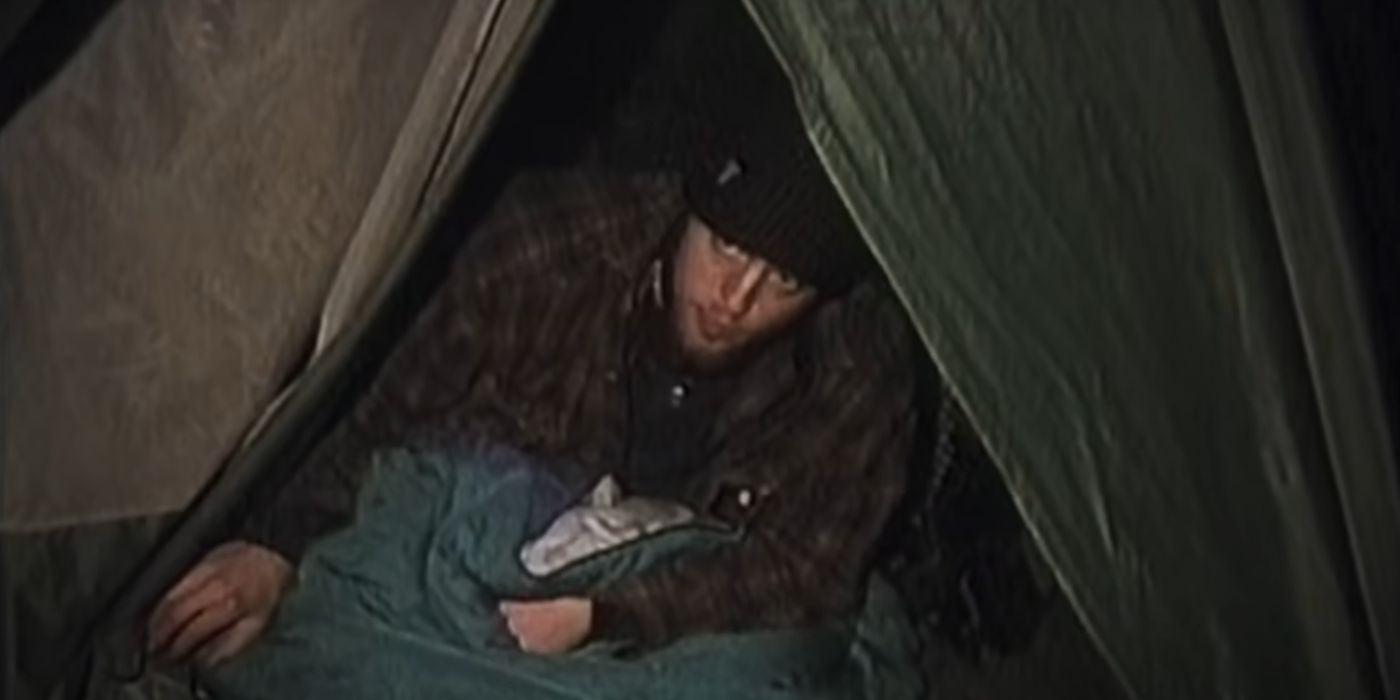 Josh Leonard coming out of a tent in The Blair Witch Project (1999).