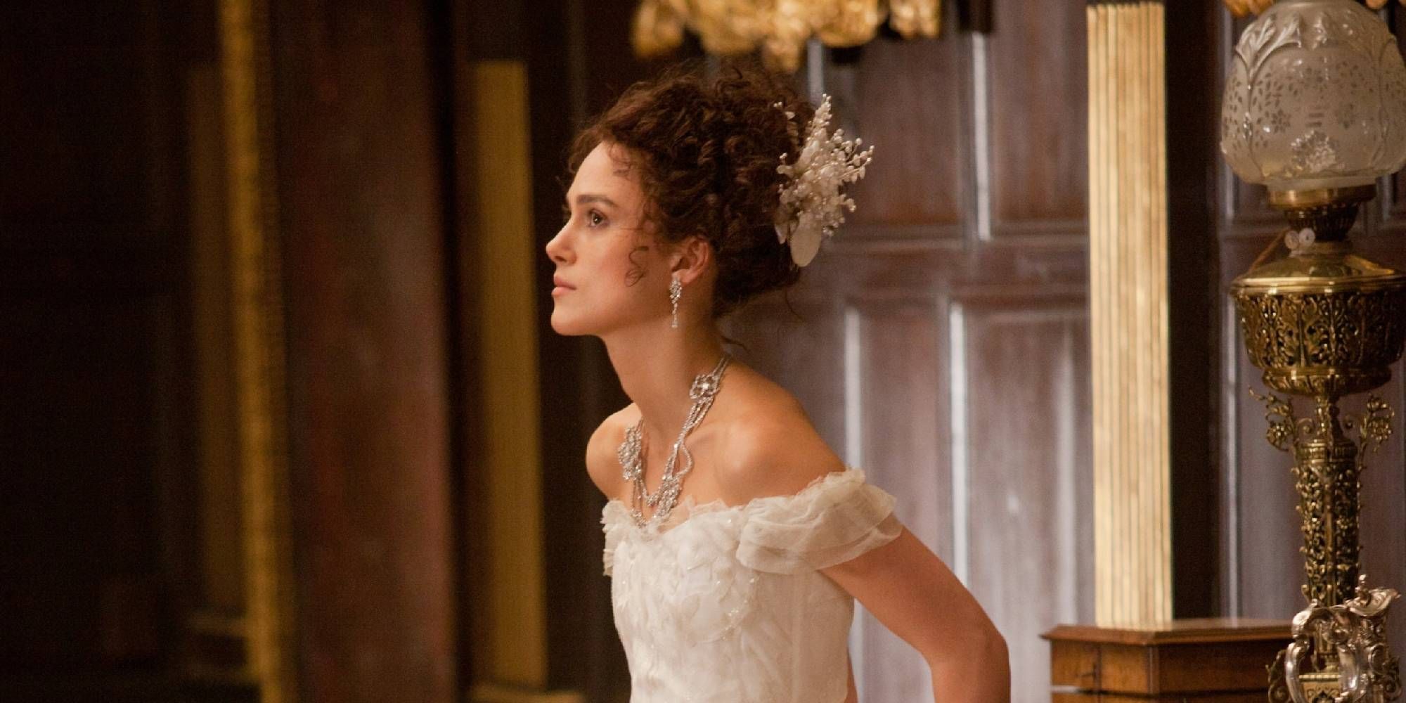 Keira Knightley in Anna Karenina with a concerned expression looking at someone off-camera.