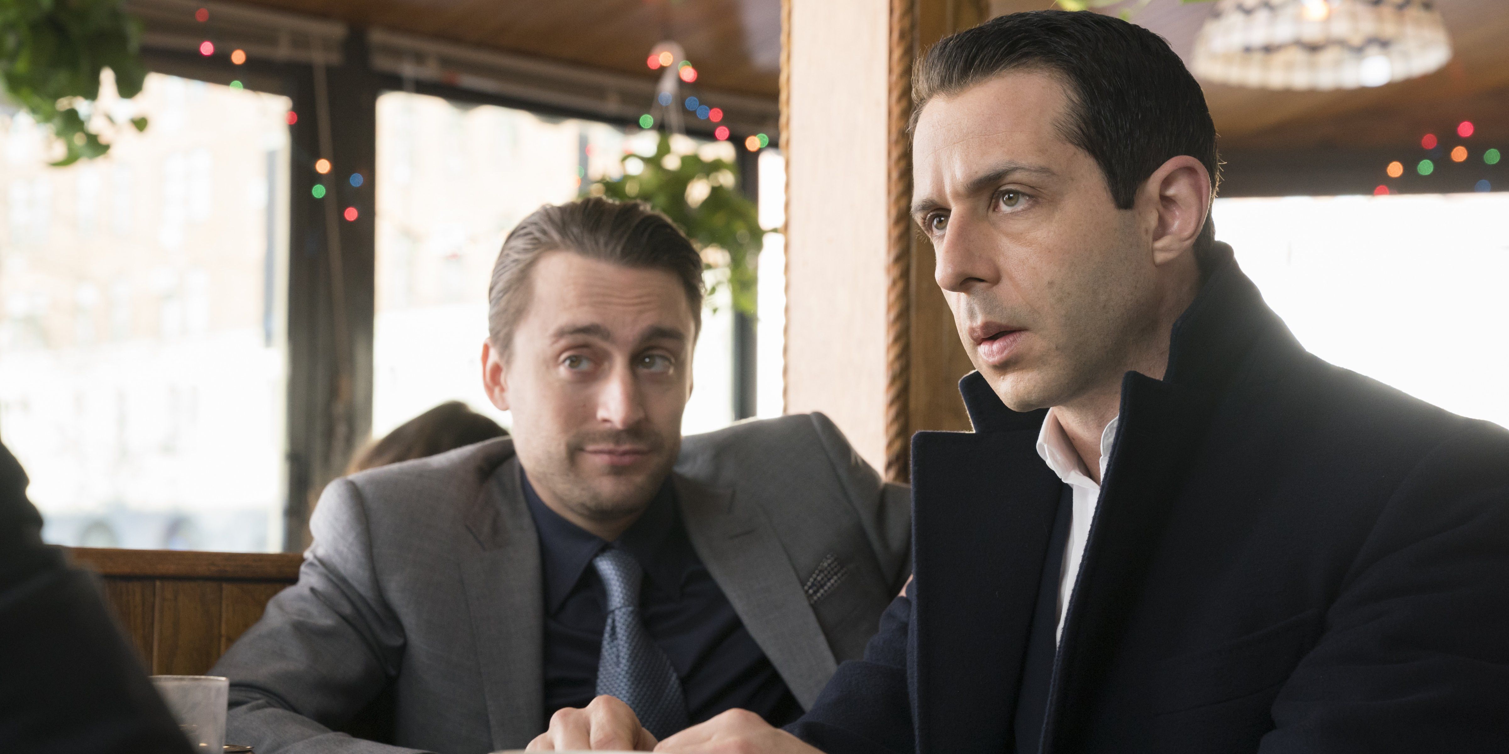 Kendall (Jeremy Strong) and Roman (Kieran Culkin) Roy sit next to each other in season one of 'Succession'