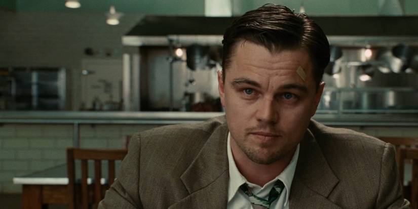 US Marshal sitting at a table looking intently in 'Shutter Island'