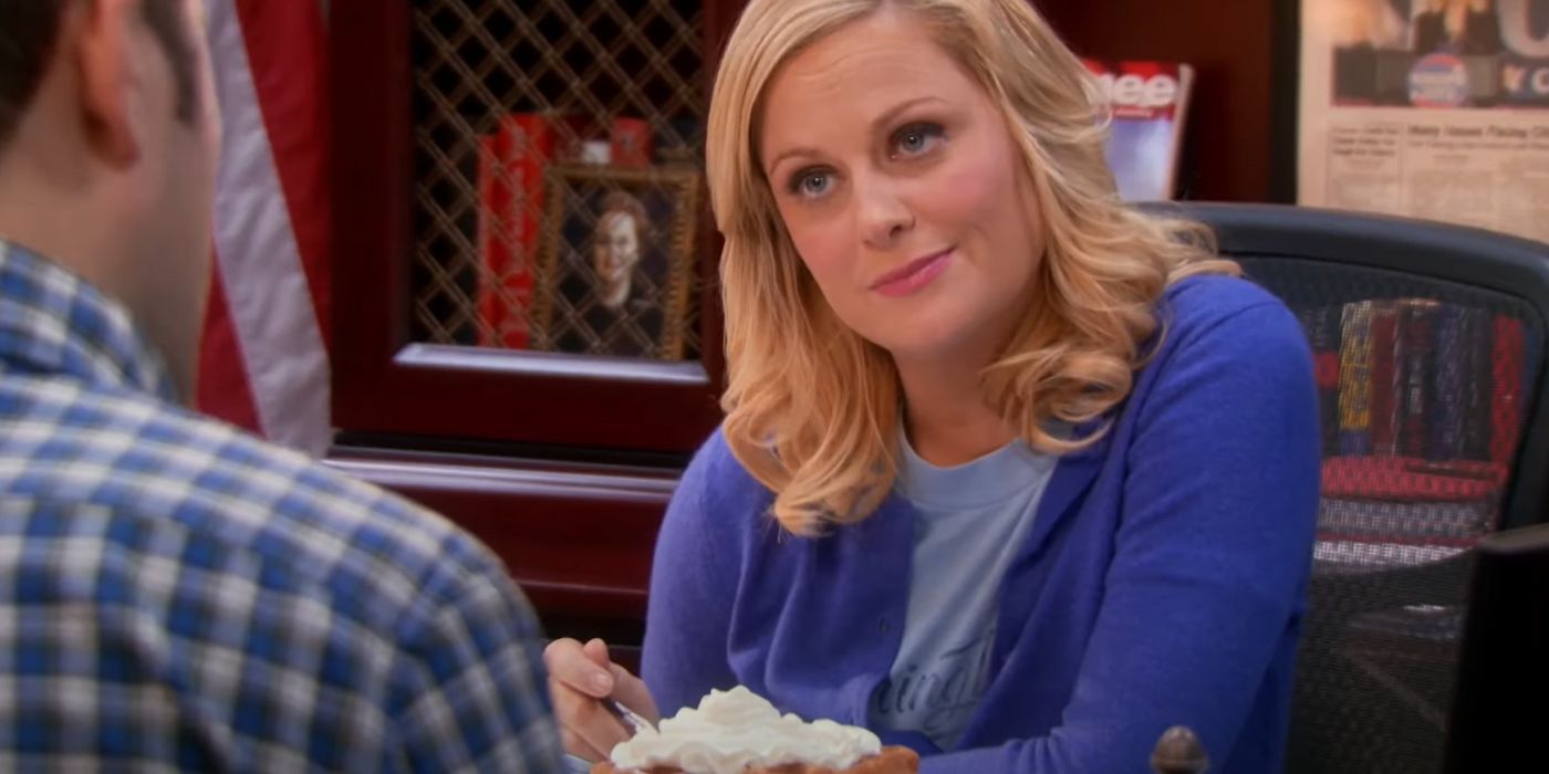 Leslie eats waffles at her desk in Parks & Rec.