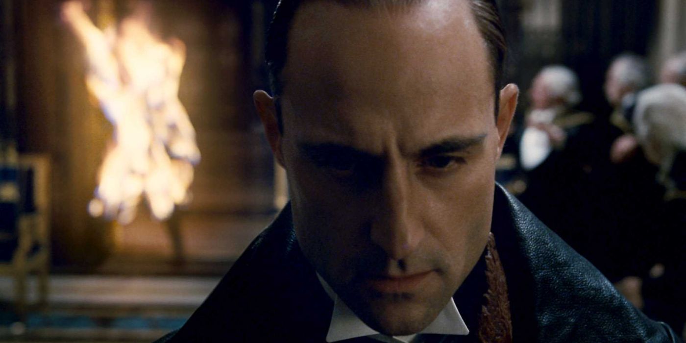 Lord Henry Blackwood (Mark Strong) walks on with a sense of purpose as a man burns to death behind him.