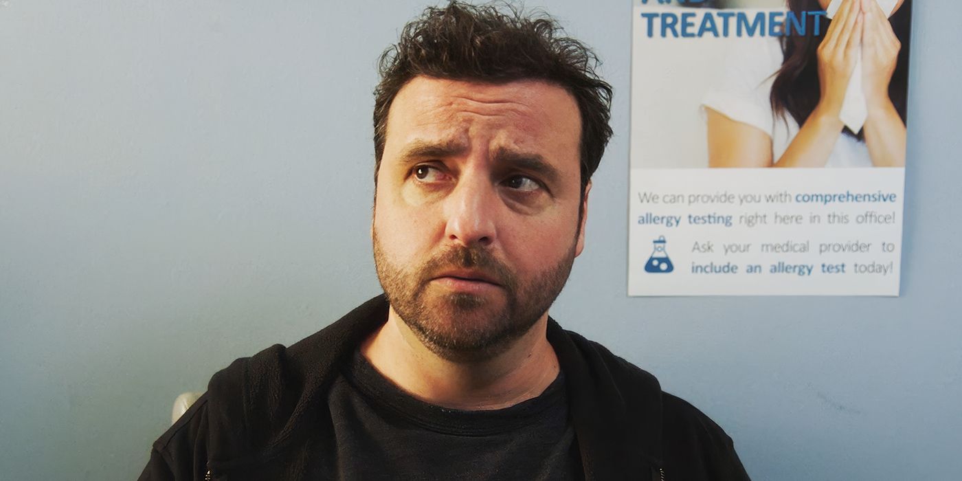 David Krumholtz sitting in a doctor's office looking concerned in Lousy Carter. 