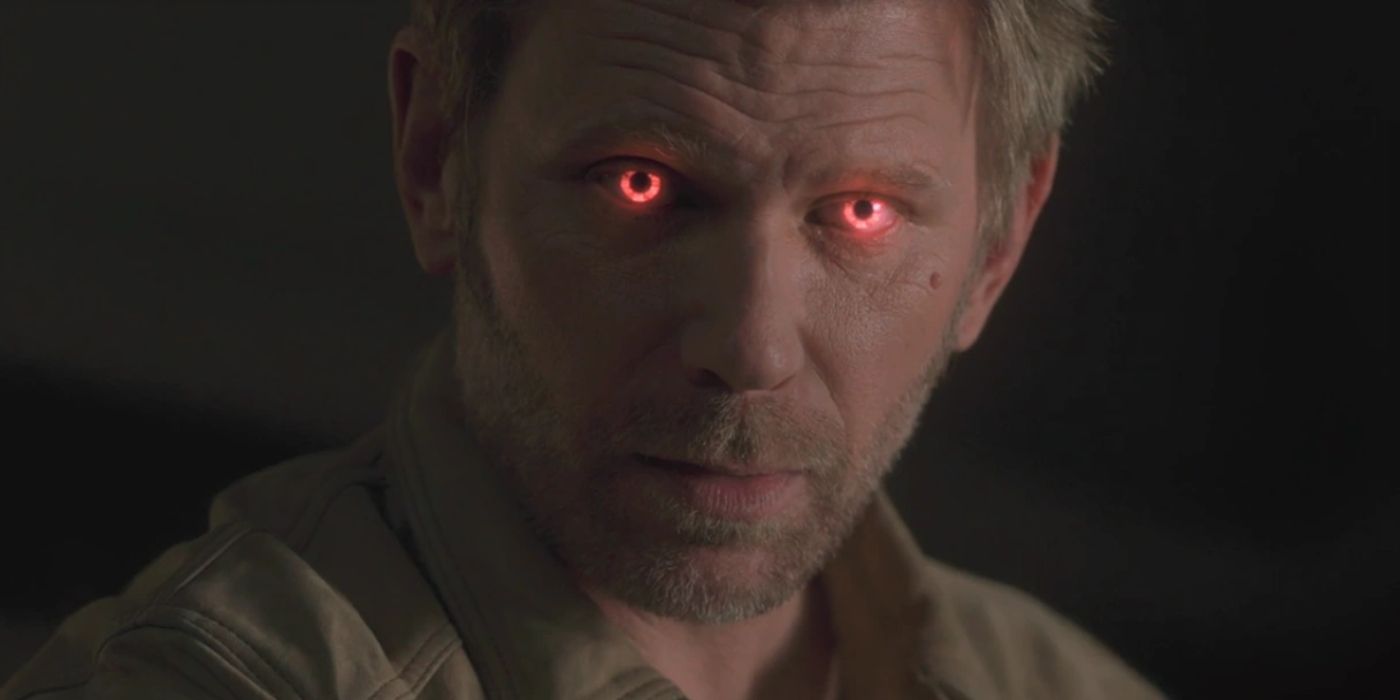 Lucifer's eyes glow bright red as he glares down at something in Supernatural