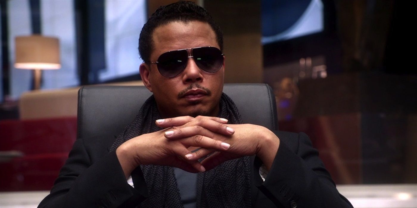 Terrence Howard as Lucious Lyon sitting with his fingers interlocked in a board room in Empire