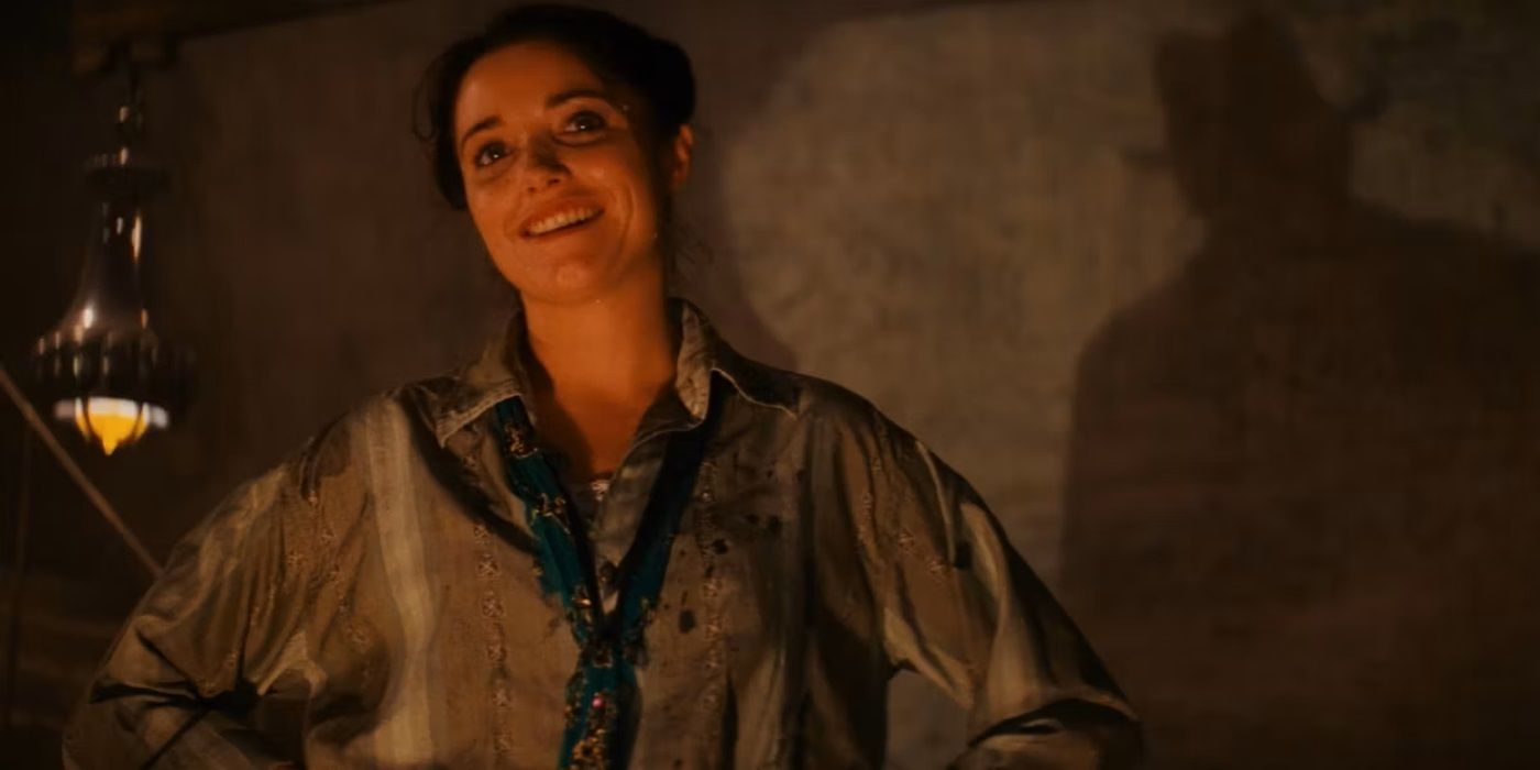 Marion Ravenwood smiling as she reunites with Indiana Jones in Raiders of the Lost Ark