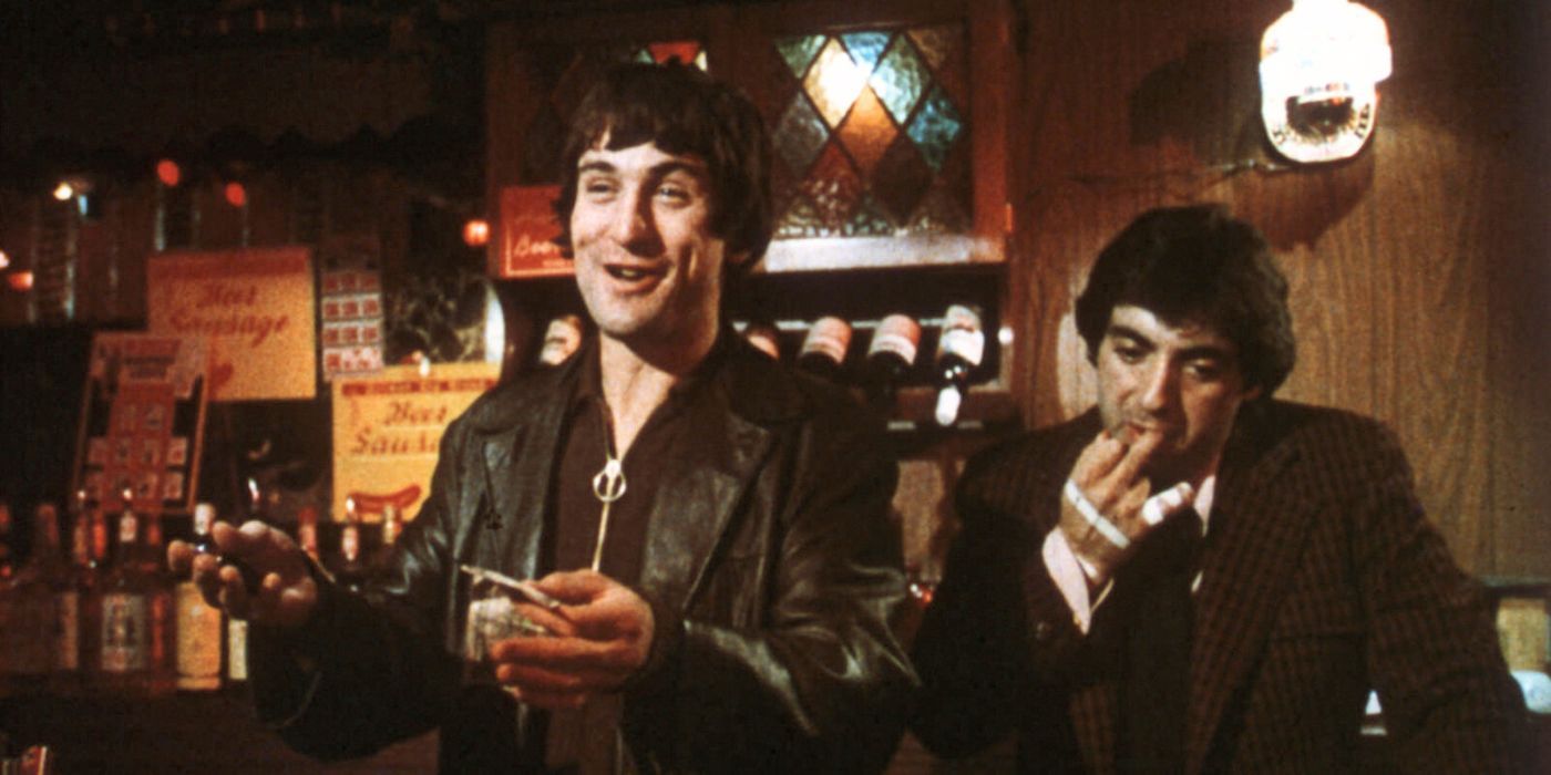 Robert De Niro and David Proval next to each other in a bar in Mean Streets
