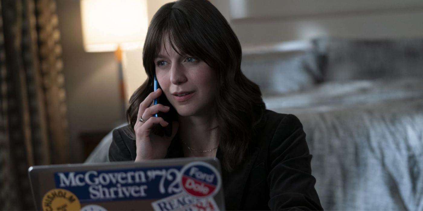 Melissa Benoist talking on the phone while sitting in front of her laptop in a scene in 'The Girl on the Bus'