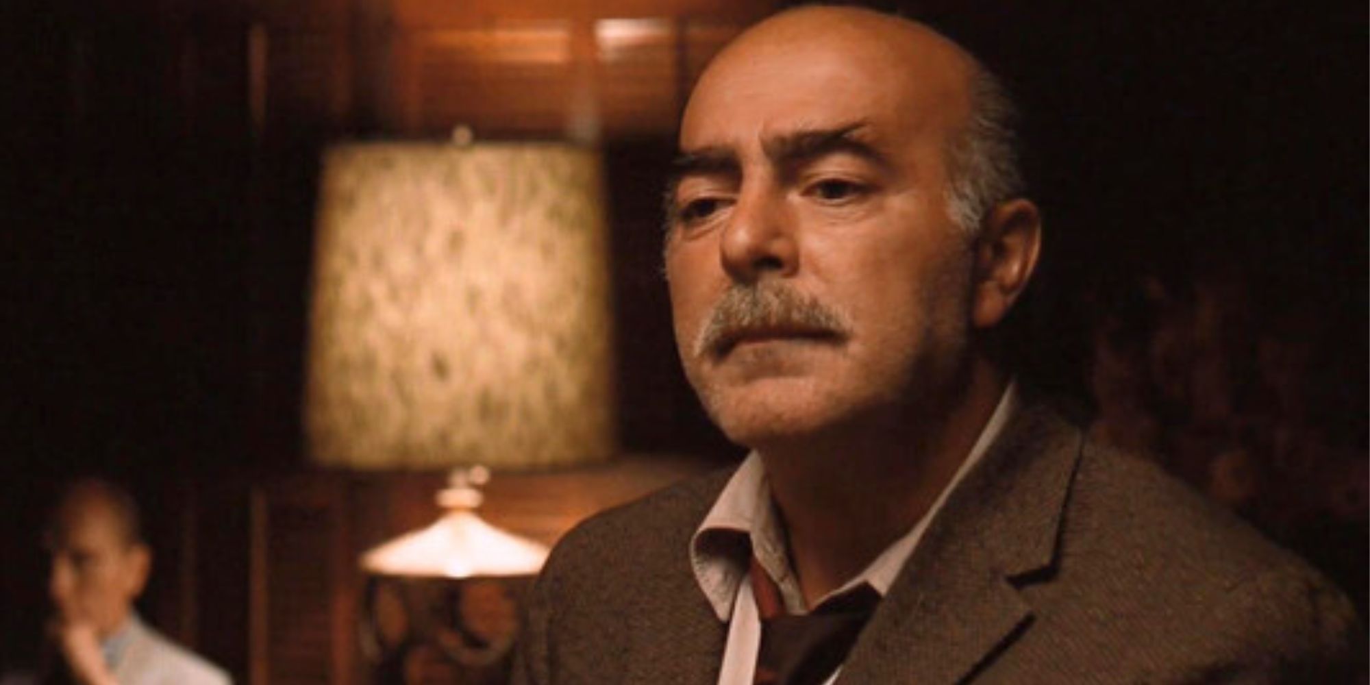 Michael V. Gazzo standing in a room in The Godfather: Part II (1974)