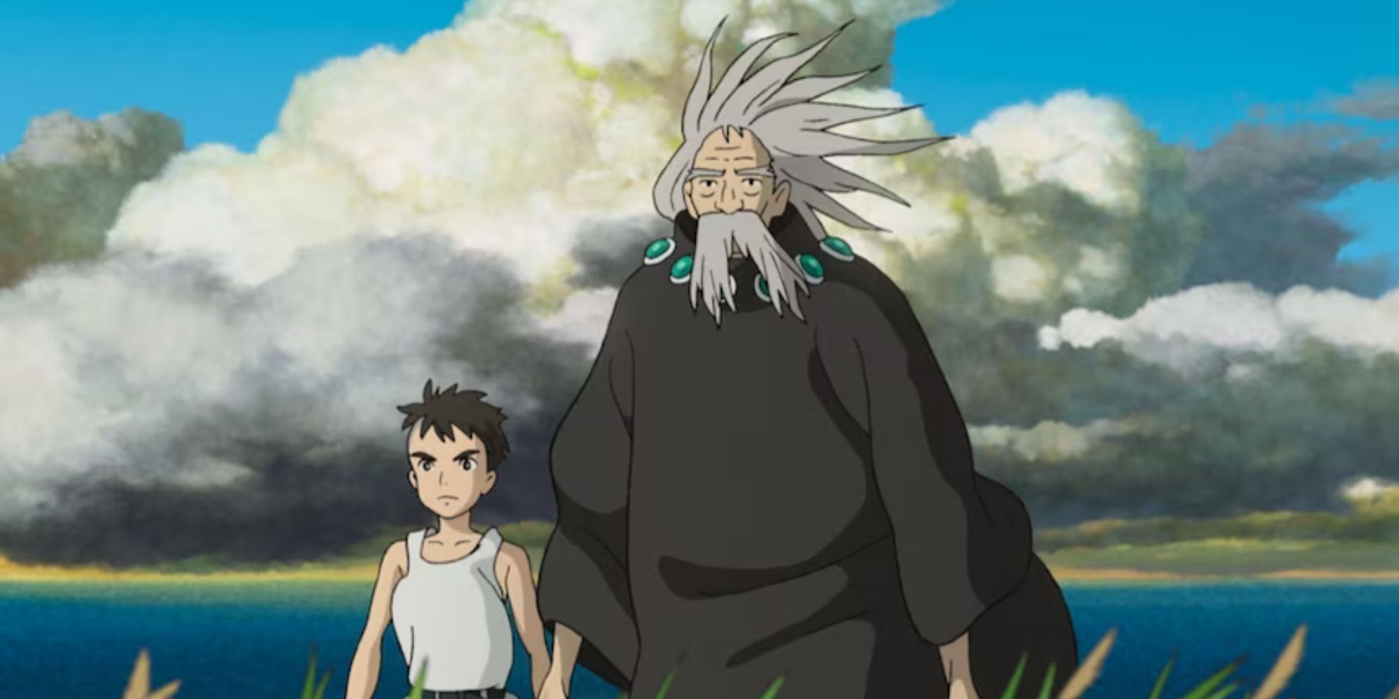 Mahito and his grandfather walking together on the open field with wind blowing on their face The Boy and the Heron