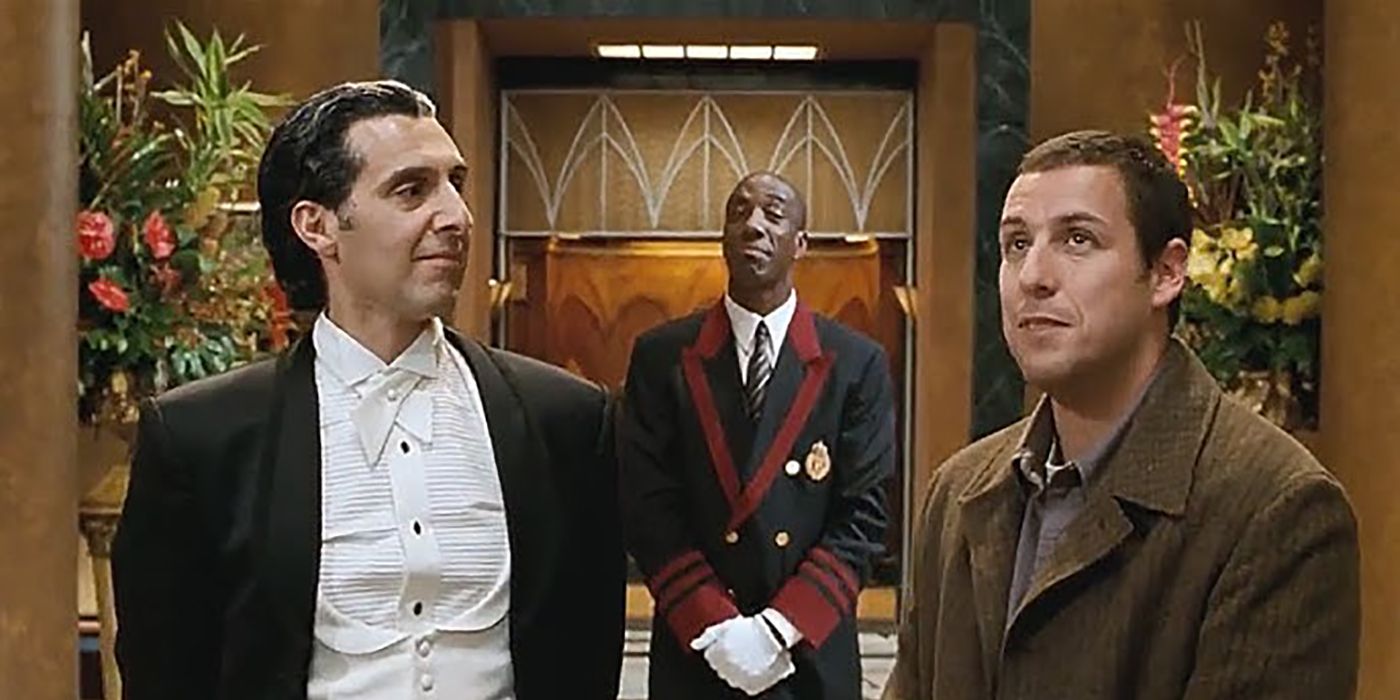 Adan Sandler in Mr. Deeds looking at the mansion with the butler and another staff member behind him.