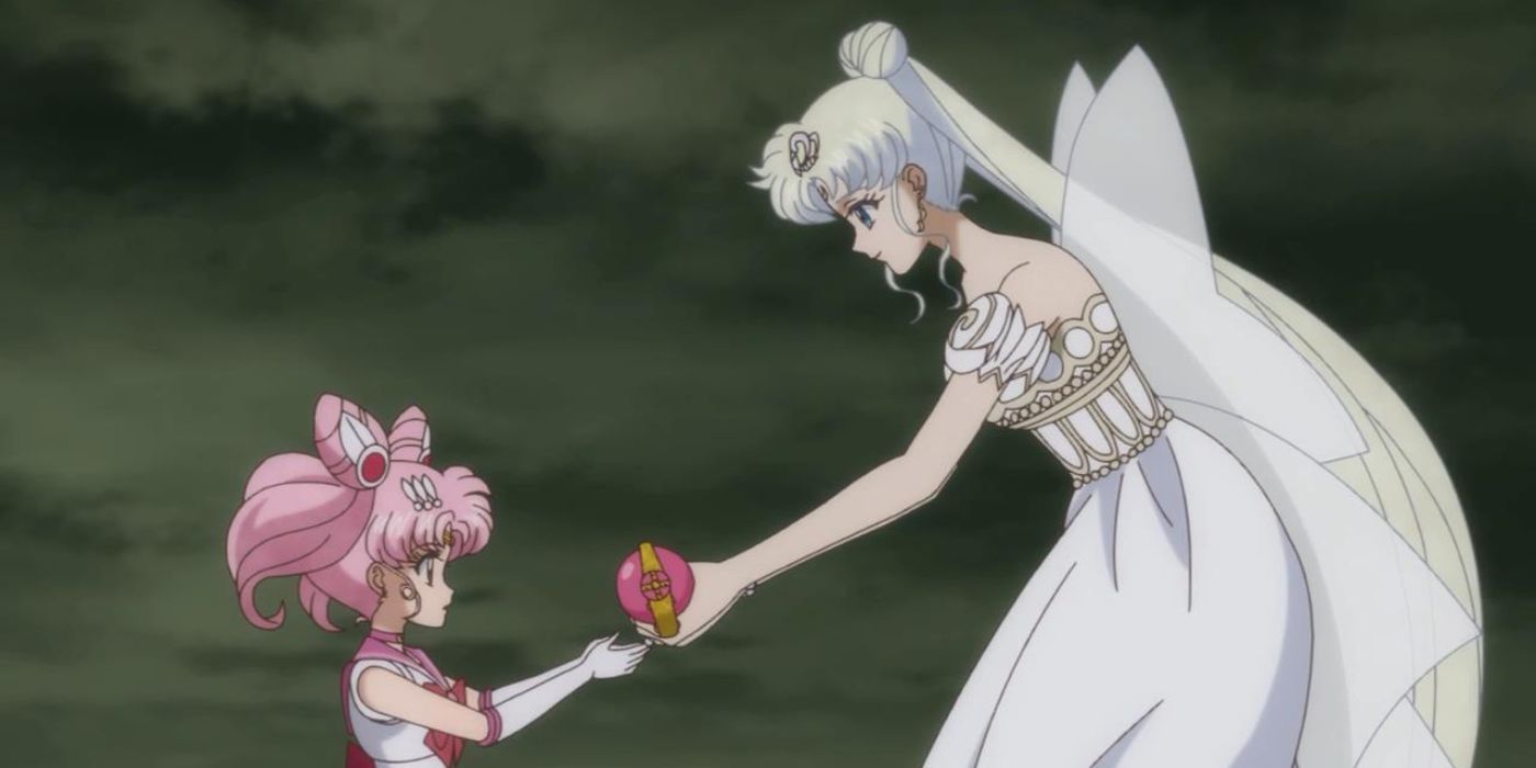Neo Queen Serenity handing something to Small Lady in Sailor Moon