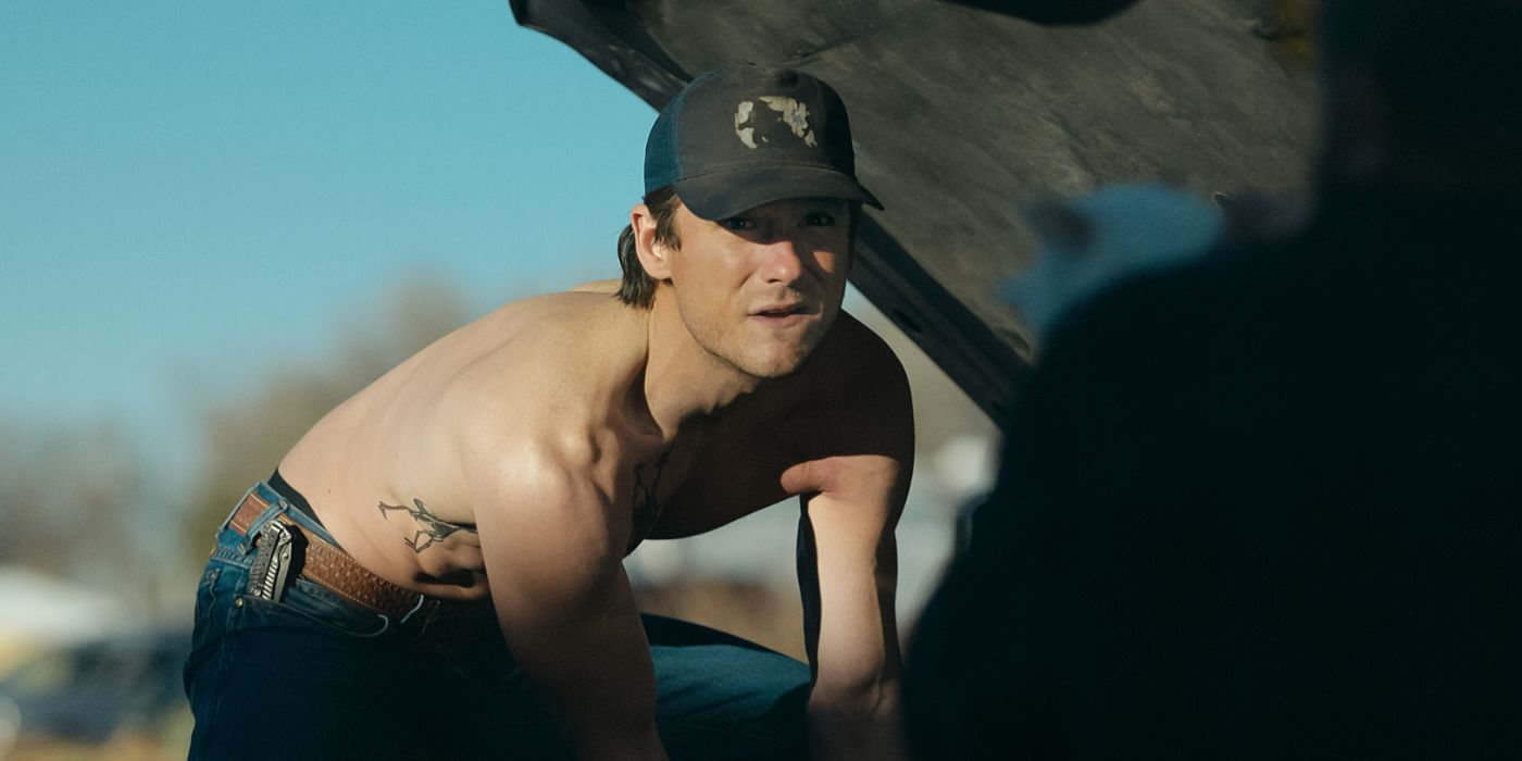 Lewis Pullman works on a car shirtless in Outer Range 