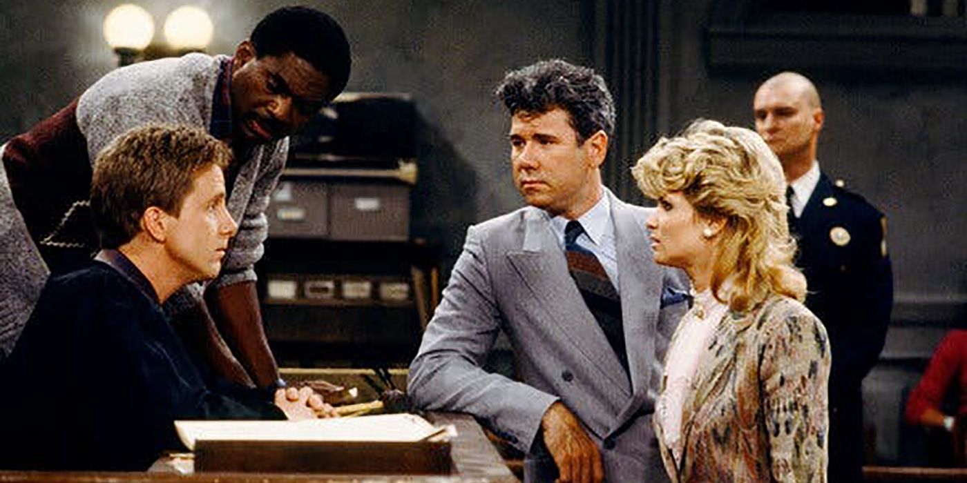The cast of Night Court hovering around the bench.