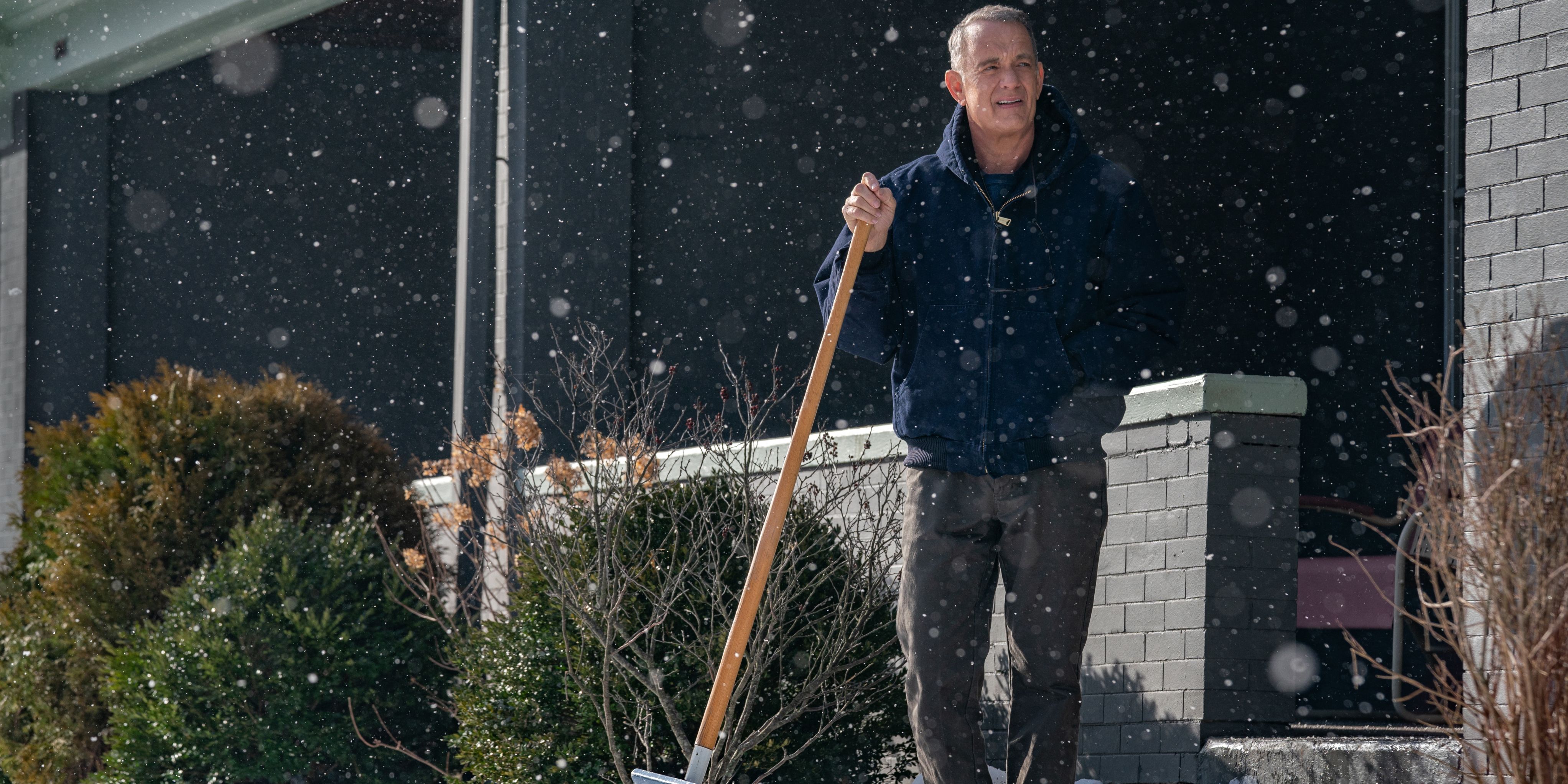 Otto (Tom Hanks) standing with a shovel in the snow A Man Called Otto