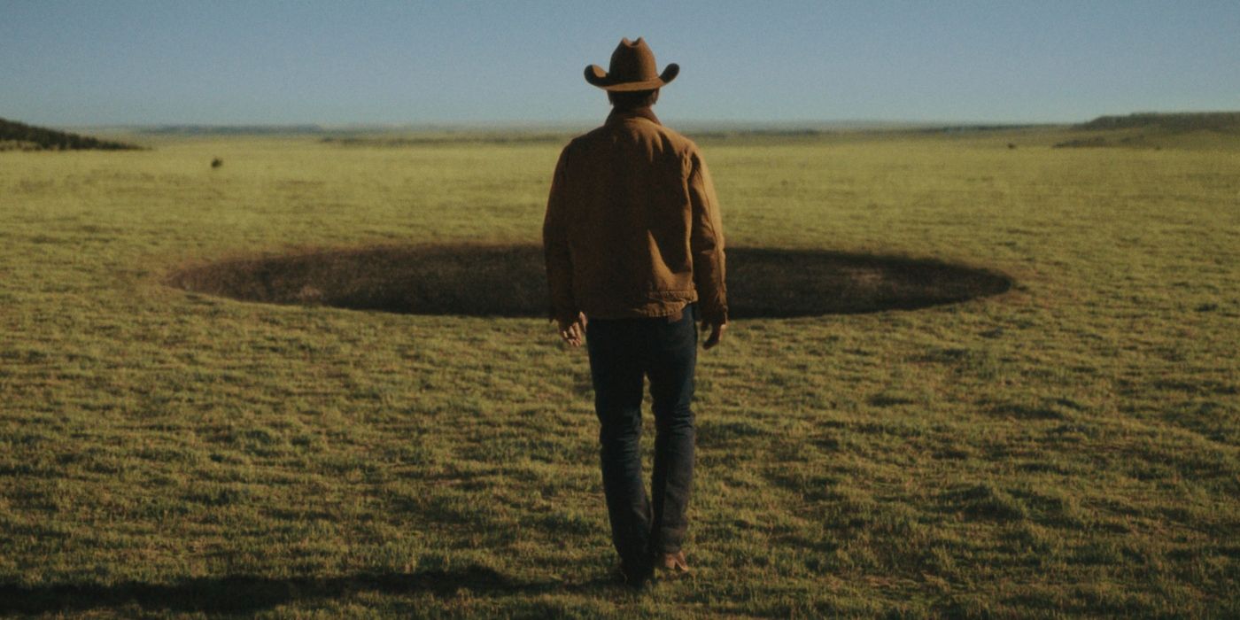 Josh Brolin walks toward a hole in the ground in Outer Range