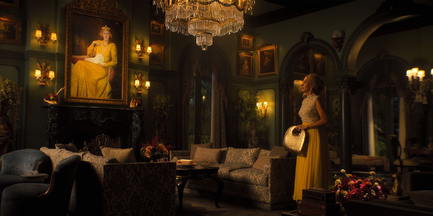Kristen Wiig stands in a luxurious room in a scene from Palm Royale