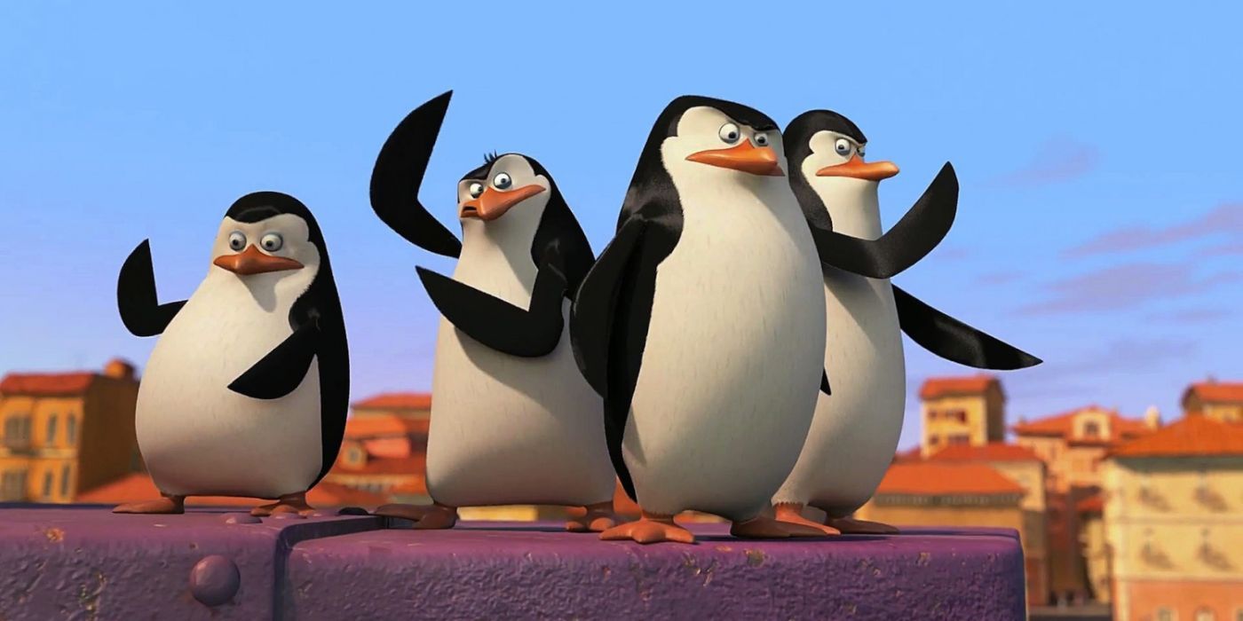 Private, Rico, Skipper, and Kowalski huddled and raising their fins in The Penguins of Madagascar