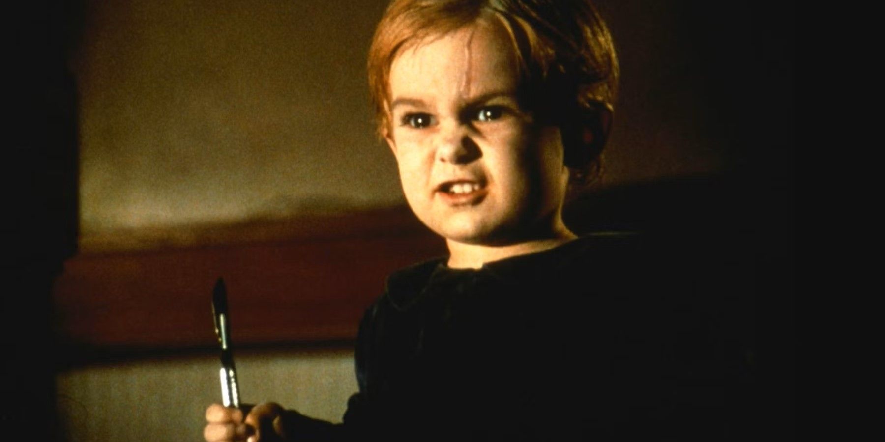 The undead Gage (Miko Hughes) holds a scalpel in 'Pet Sematary'