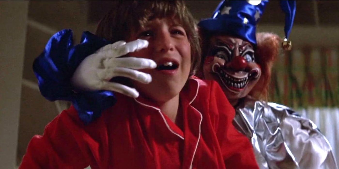 Robbie Freeling (Oliver Robins) is attacked by a clown doll in 'Poltergeist'