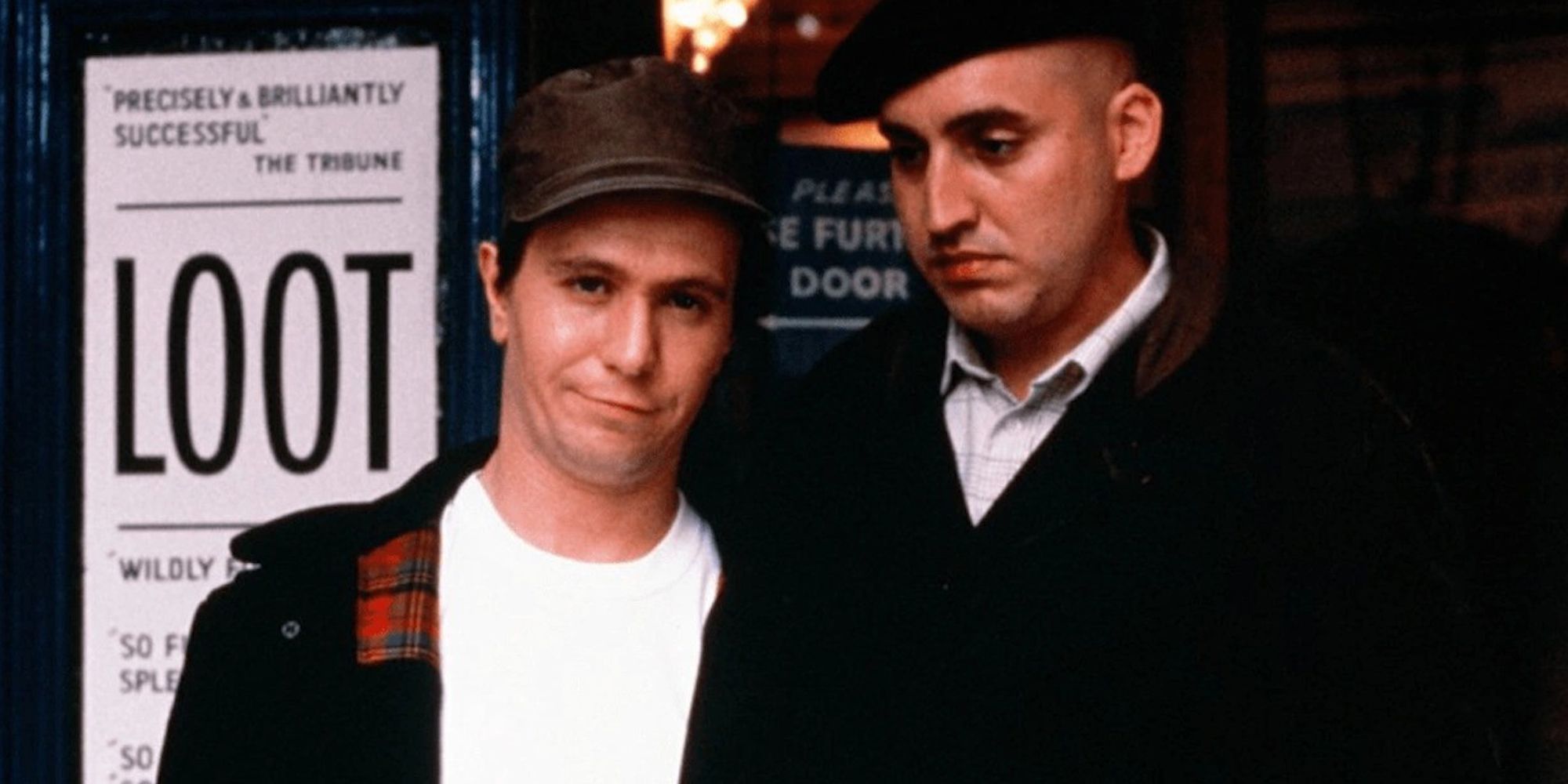 Joe Orton and Kenneth Halliwell standing next to each other in Prick Up Your Ears