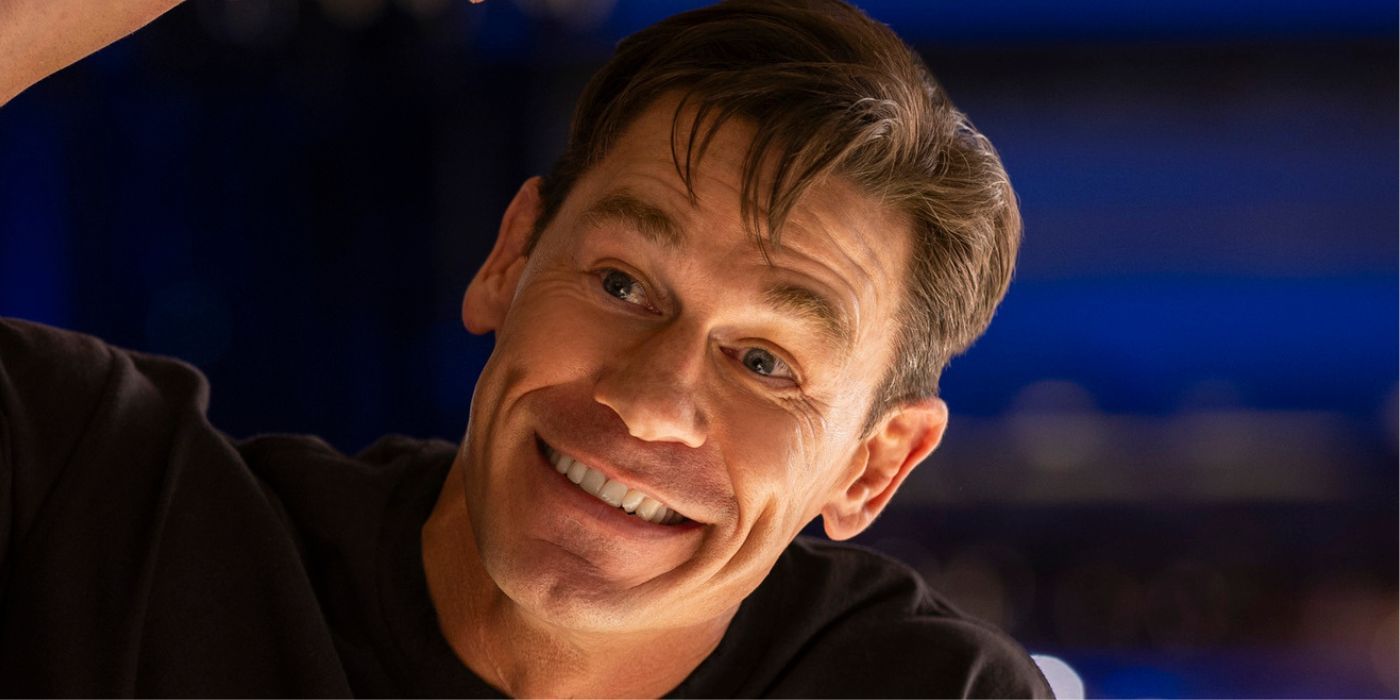 John Cena smiling playing the title role in Ricky Stanicky.