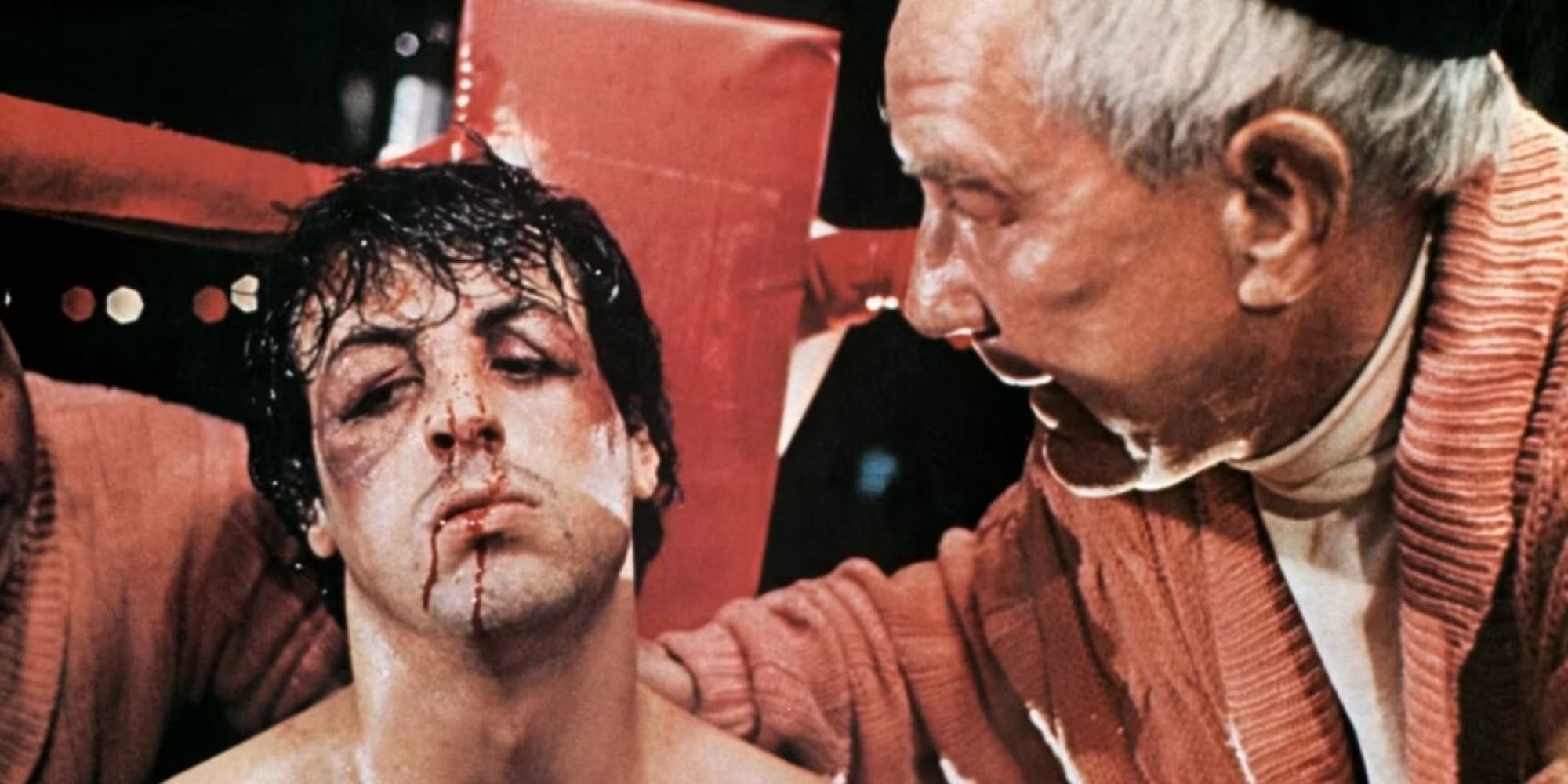 A bloody and bruised Rocky (Sly Stallone) who Mickey (Burgess Meredith) talks to in Rocky