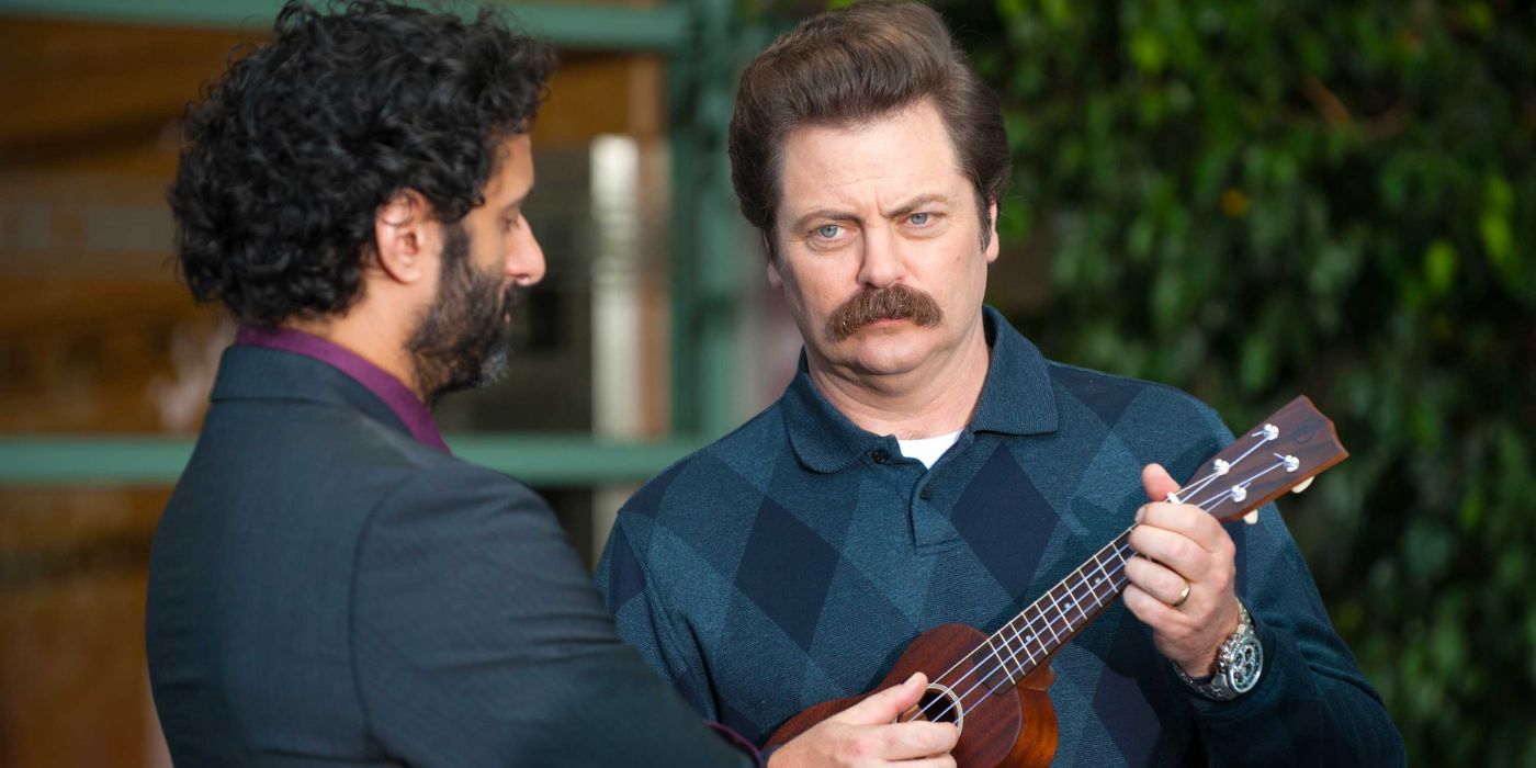 Ron Swanson (Nick Offerman) plays the ukulele outside in Parks and Recreation