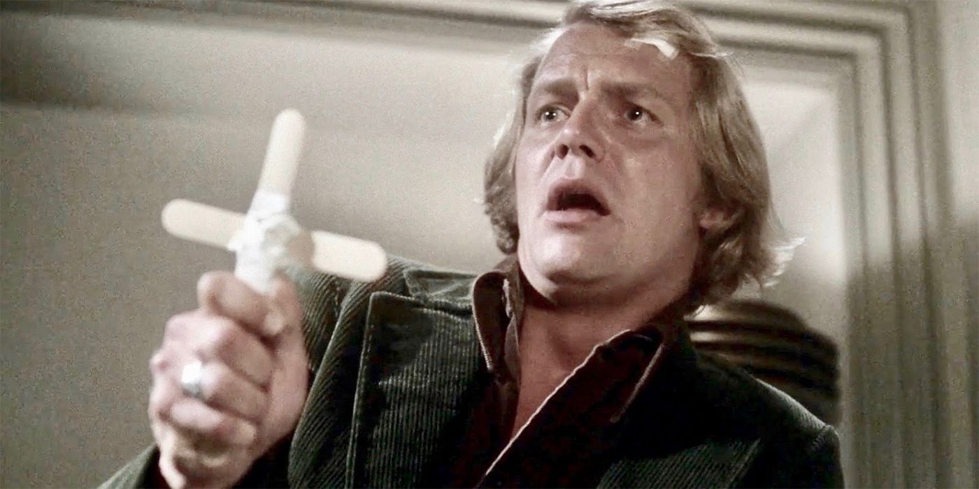 David Soul holding up a cross in Salem's Lot (1979)