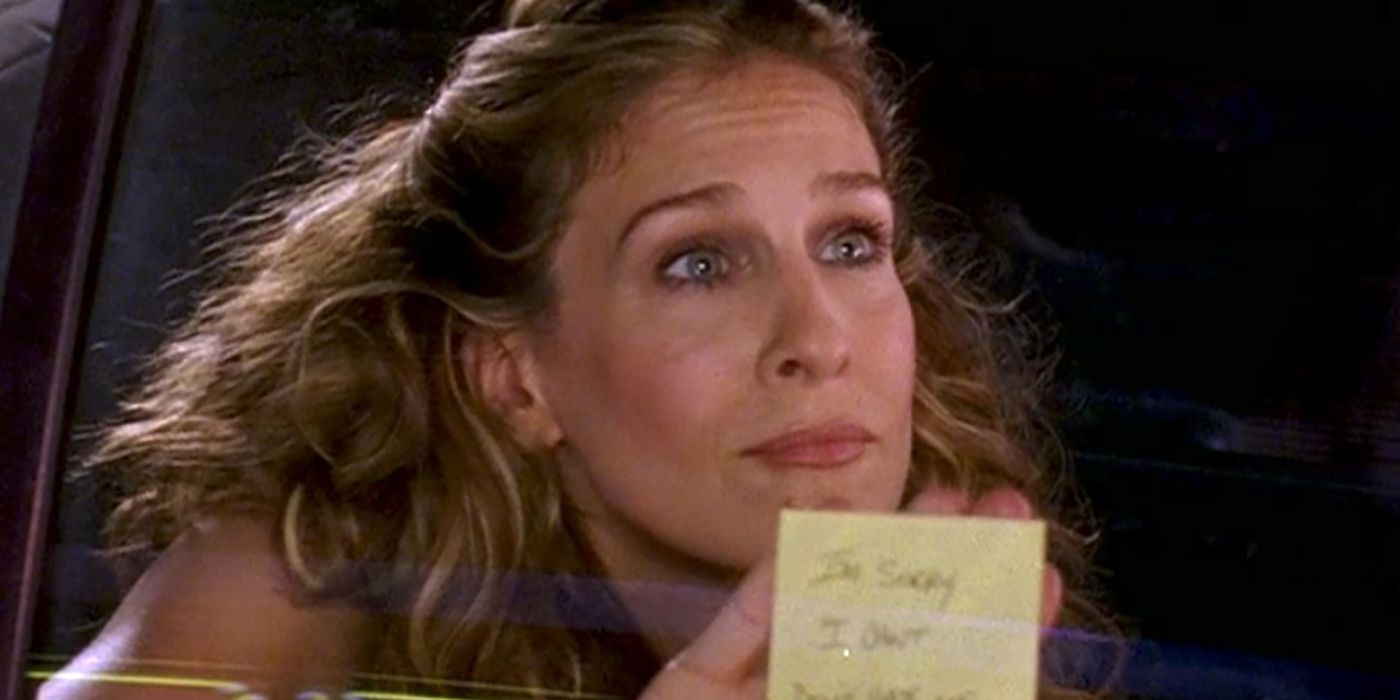Carrie holding a Post-It note with a break-up message up to the window of a car on Sex and the City.
