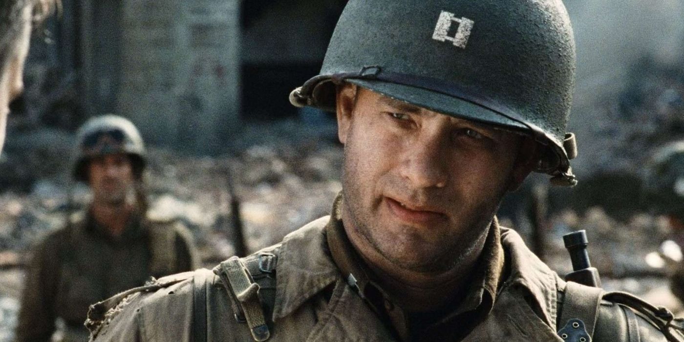 Captain John Miller stands in a ruined city wearing an army helmet in 'Saving Private Ryan' (1998)