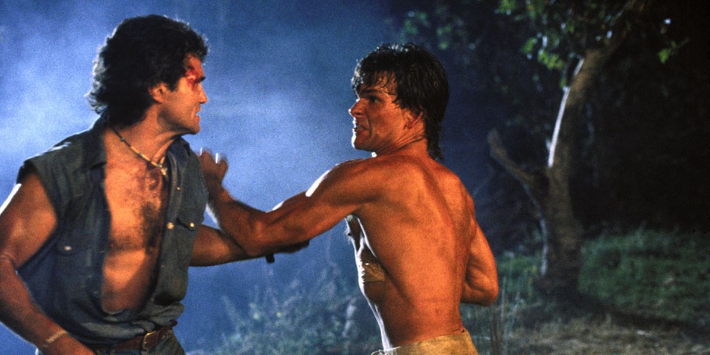 Patrick Swayze and Marshall Teague as Dalton and Jimmy fighting shirtless in &lsquo;Road House&rsquo;.