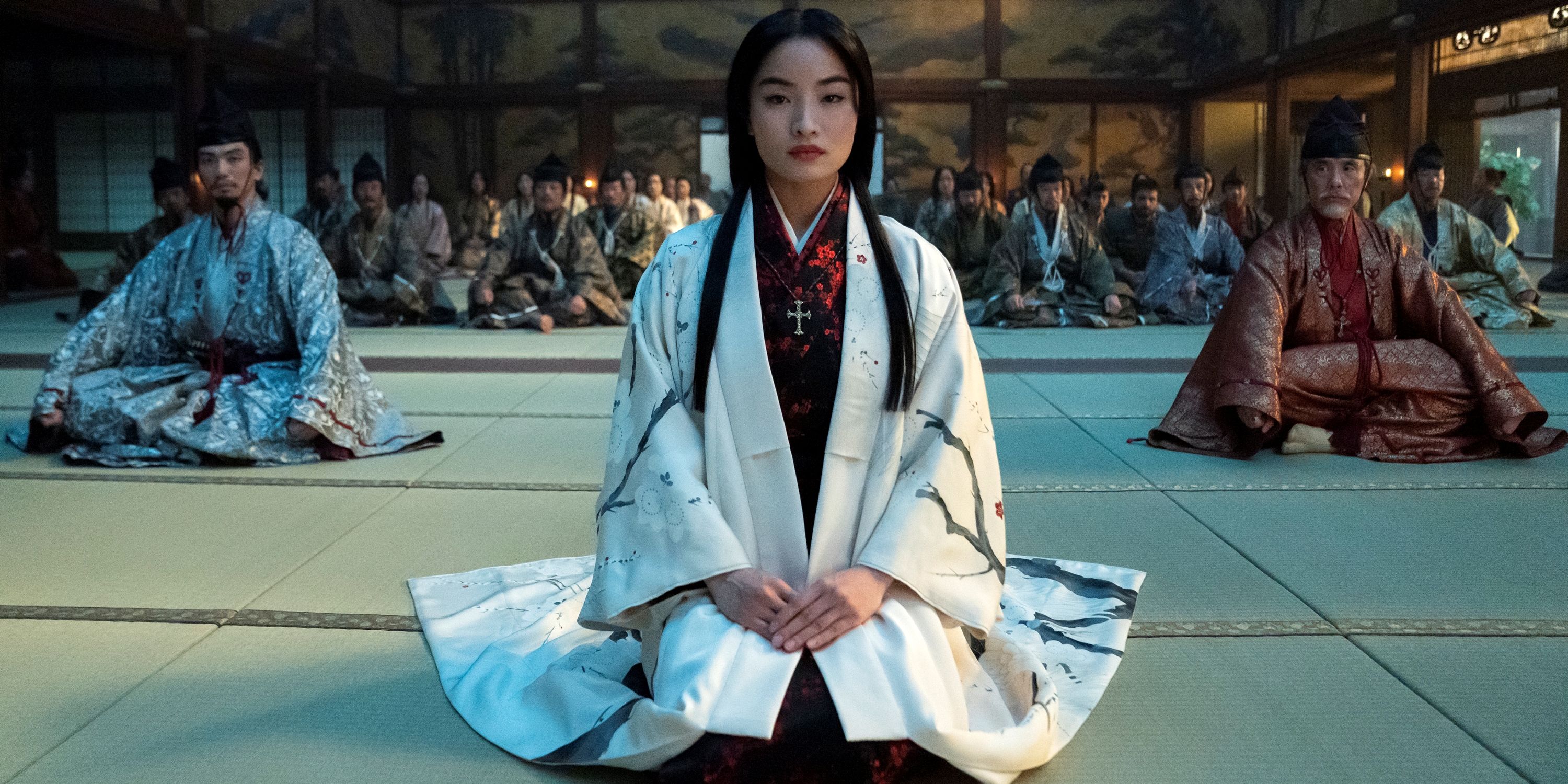 Anna Sawai as Mariko sitting in a white kimono in Episode 9 of Shogun