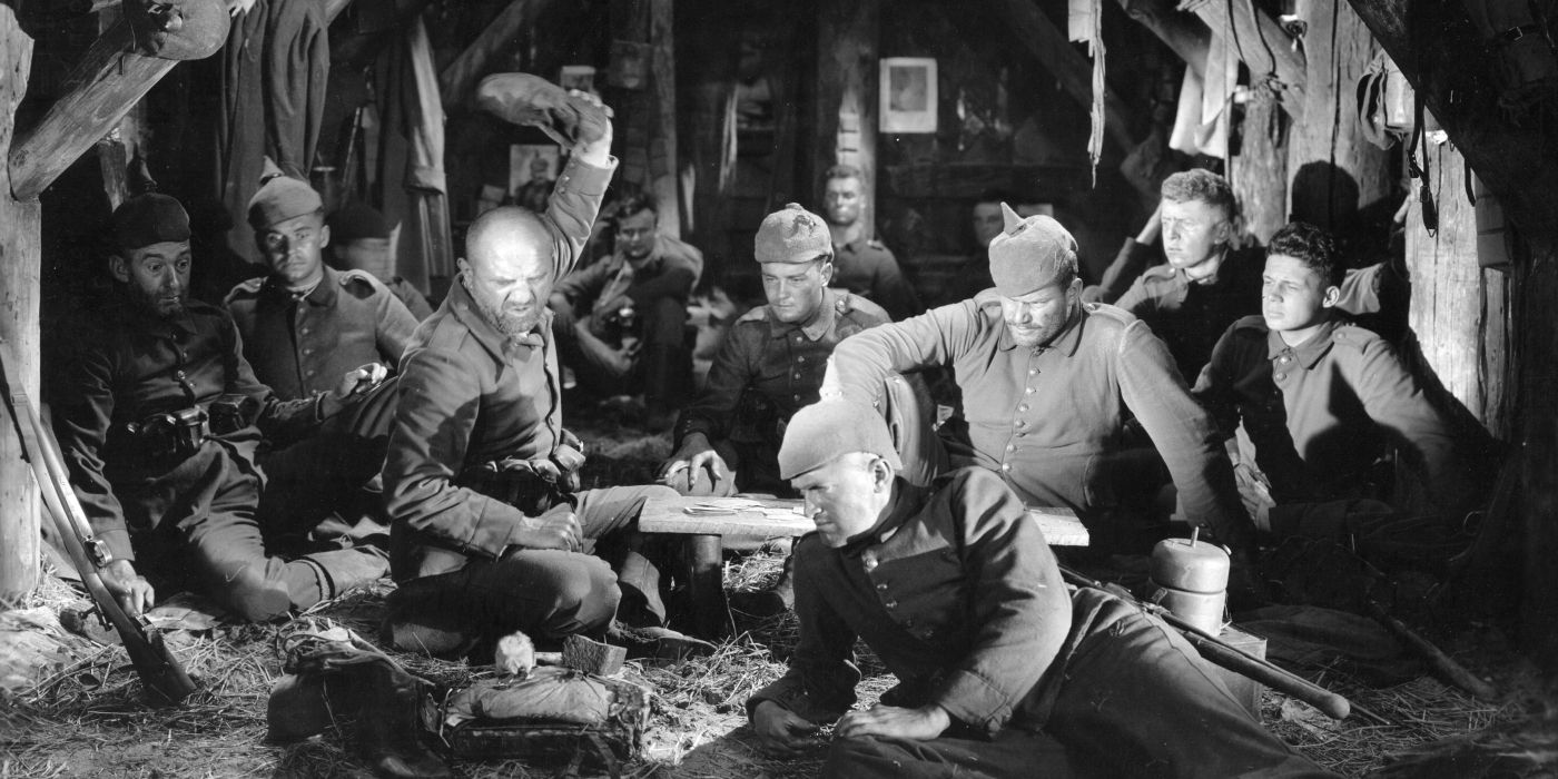 Soldiers in a barn in All Quiet on the Western Front