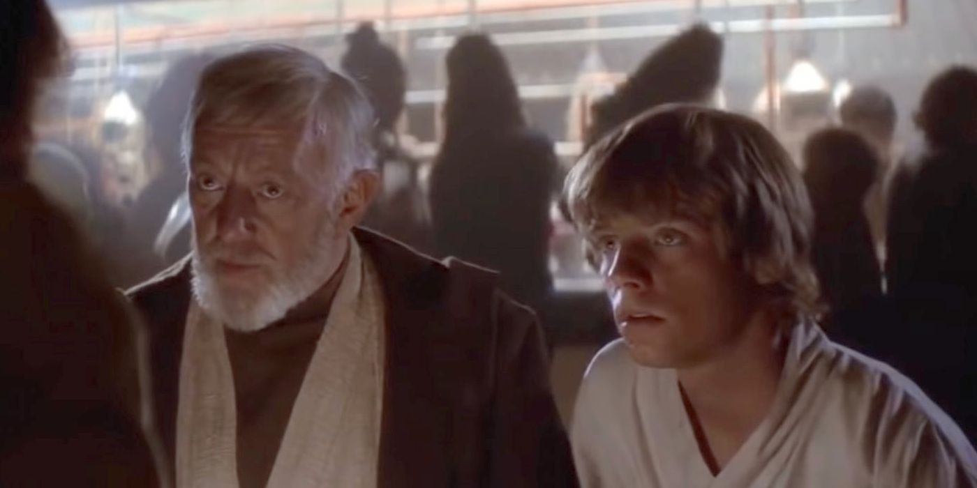 Alec Guinness as Obi-Wan Kenobi & Mark Hamill as Luke Skywalker talking to a person offscreen in Star Wars